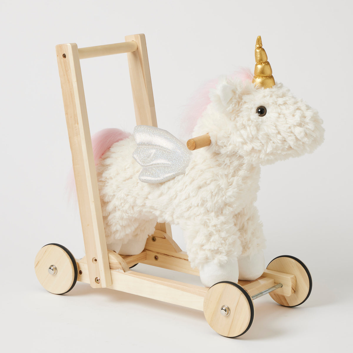 Jiggle & Giggle Unicorn Walker. Plush unicorn toy with a wooden cart on a light background