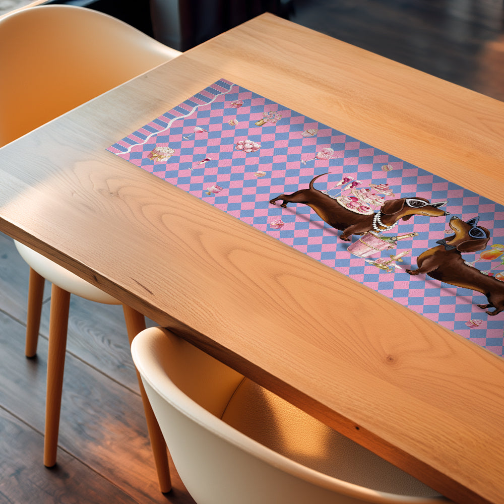Wooden table with a colorful placemat featuring cartoon dogs on a checkered background.