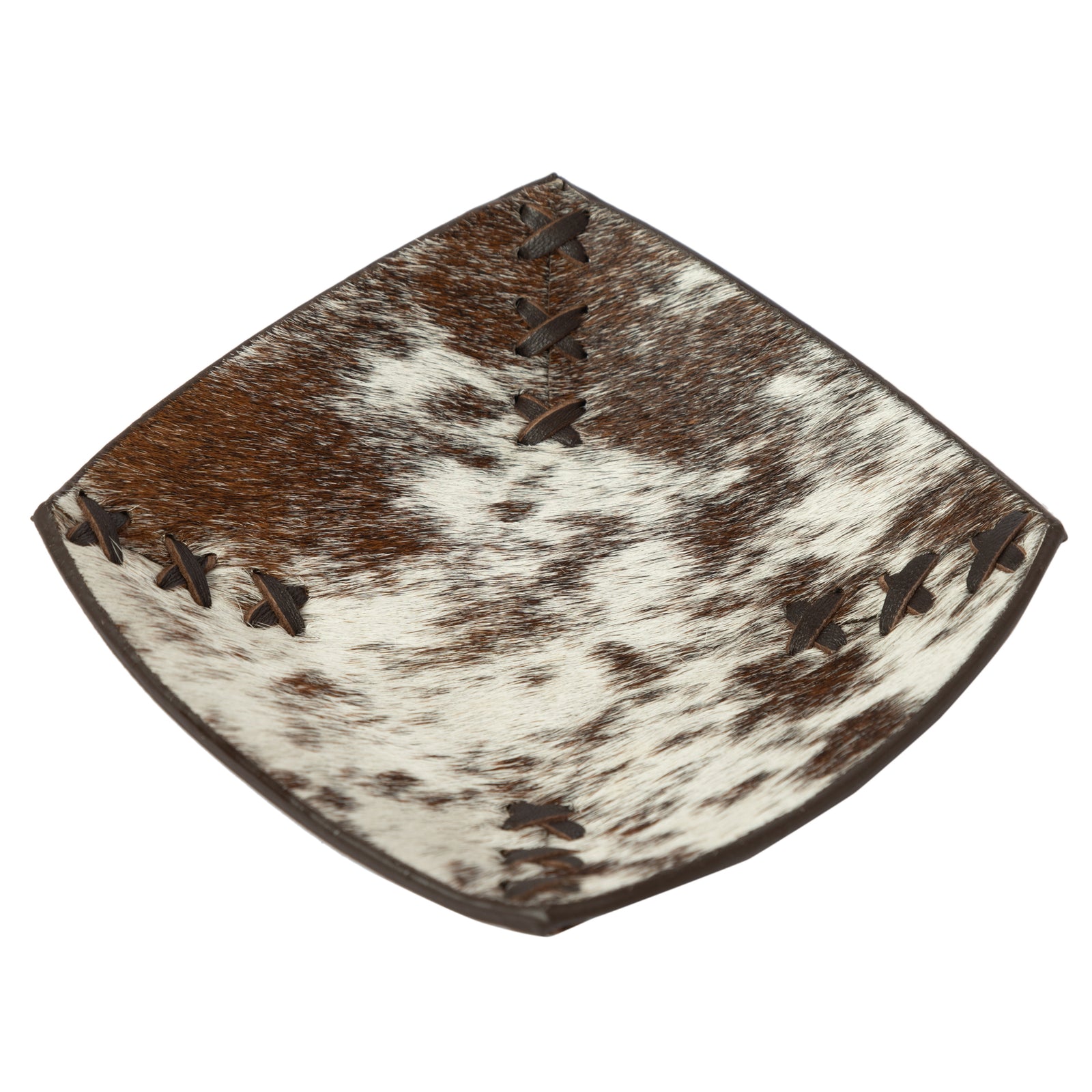 Cowhide rug with brown and white pattern on a white background
