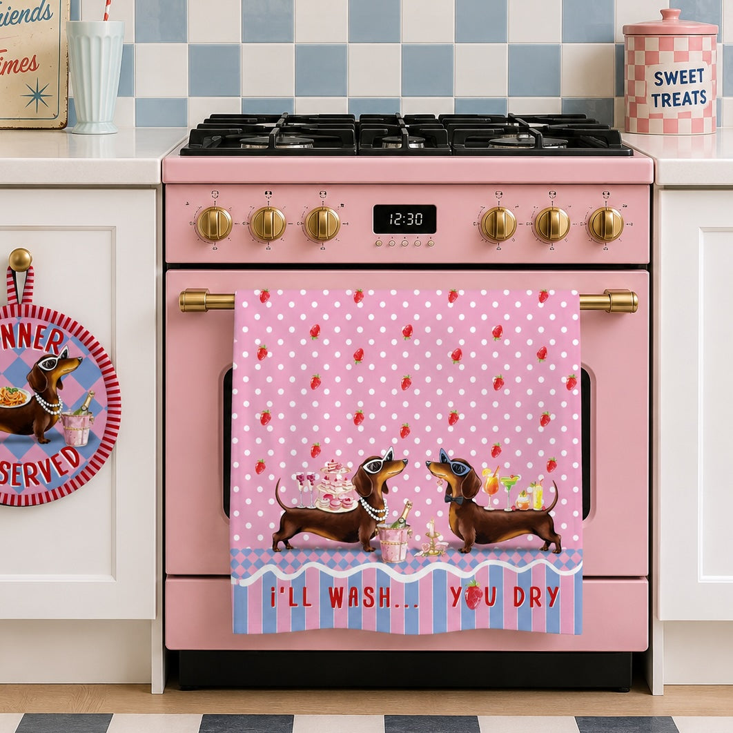 Pink polka dot towel with dachshund design hanging on a line.