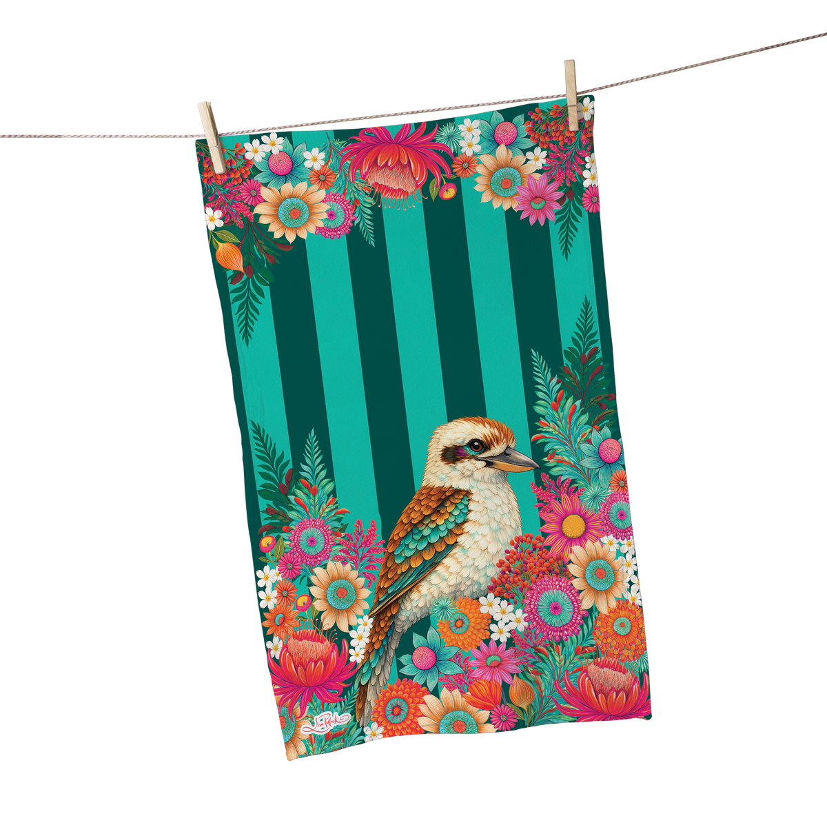A rectangular fabric towel or tea towel hanging from a clothesline with two wooden clips. The towel features a colorful floral and bird print with a kookaburra bird, pink flowers, and dark green vertical stripes on a white background.