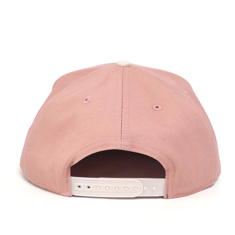 Pink cap with a white interior on a white background