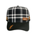 Plaid patterned cap with brown leather patch on a white background