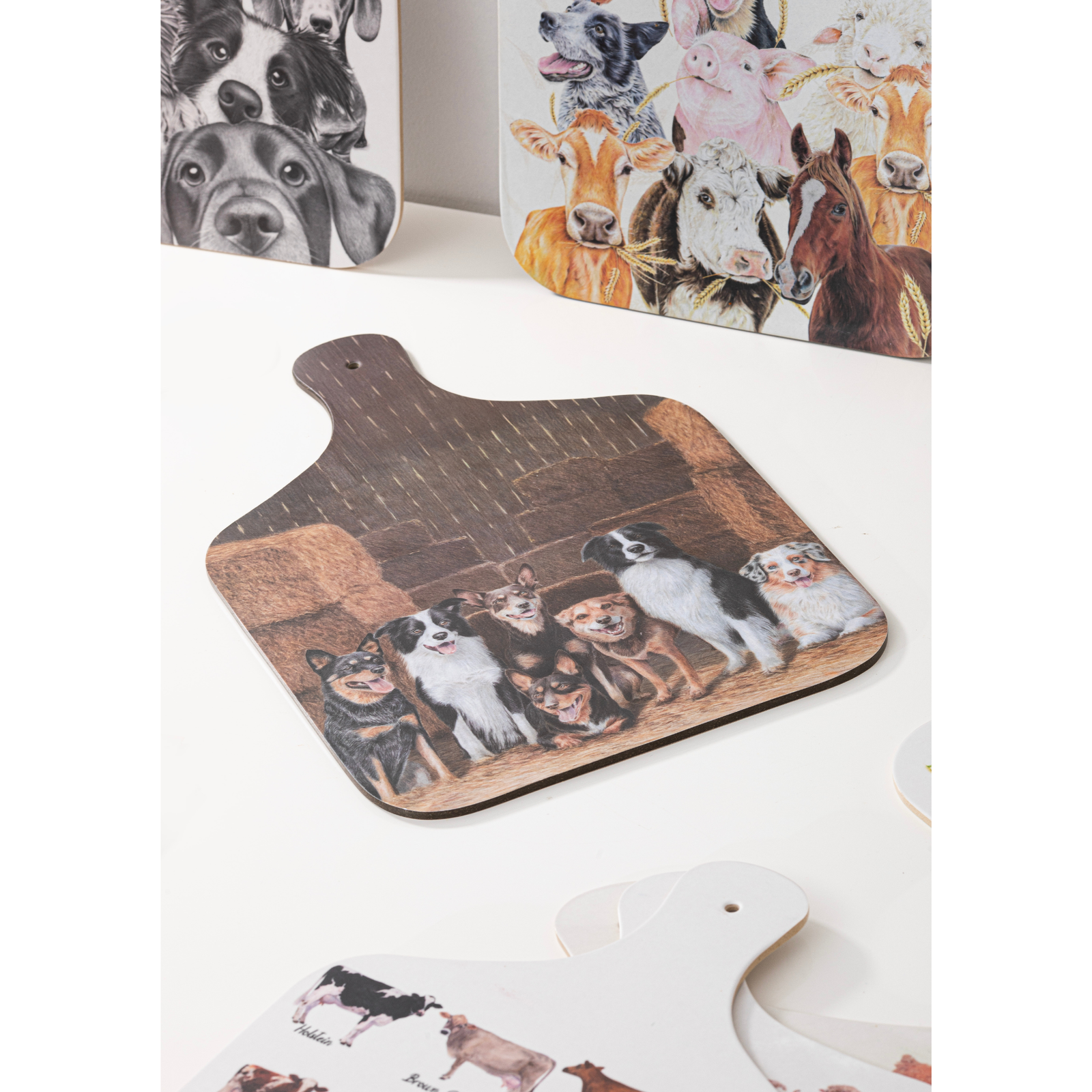 Wooden cutting board with a design of dogs on a white background