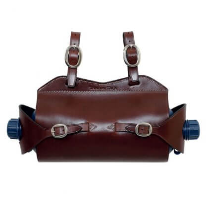 Tanami  Double Water Bottle Carrier. A brown leather double water bottle carrier with metal buckles and the Tanami Tack logo embossed on the front.