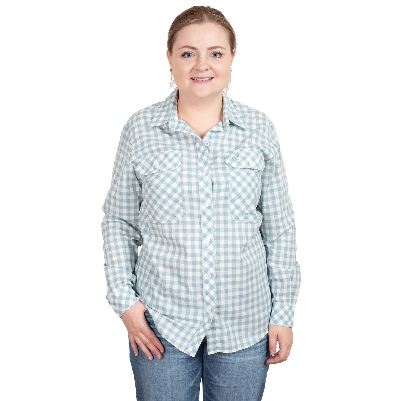 Just Country Women's Abbey Full Button L/S Shirt. A woman wearing a long-sleeved, full-button, checkered shirt in green and white, with a collar, standing against a white background.