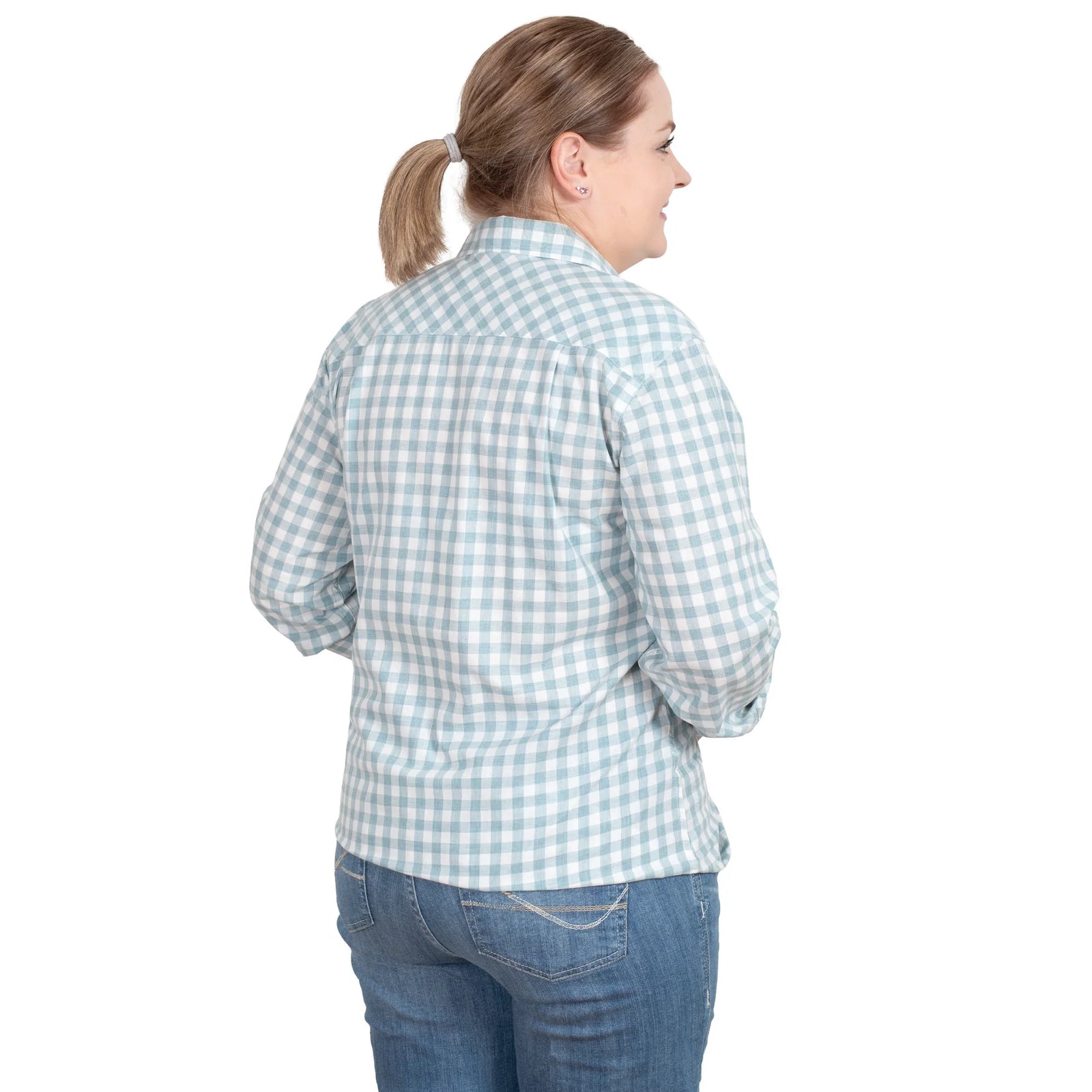 Just Country Women's Abbey Full Button L/S Shirt. A woman wearing a long-sleeved, full-button, checkered shirt in green and white, with a collar, standing against a white background.