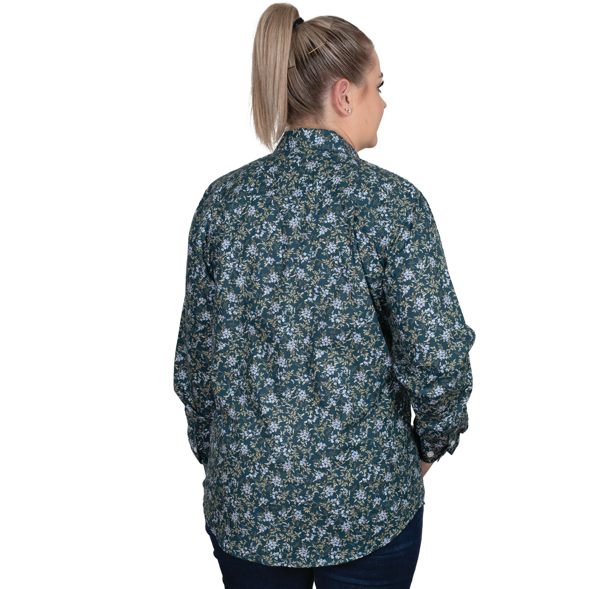 Just Country Women's Georgie Hal Button Workshirt. A woman facing away from the camera wears a long-sleeved floral shirt in various shades of green.