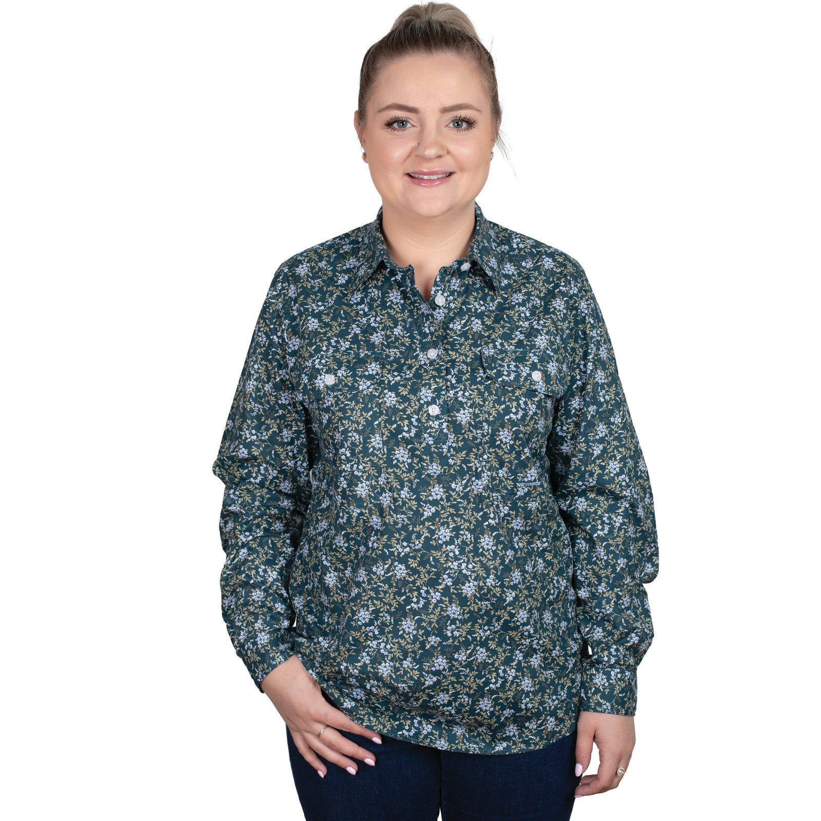 Just Country Women's Georgie Hal Button Workshirt. A woman wearing a long-sleeved floral button-up shirt and jeans.