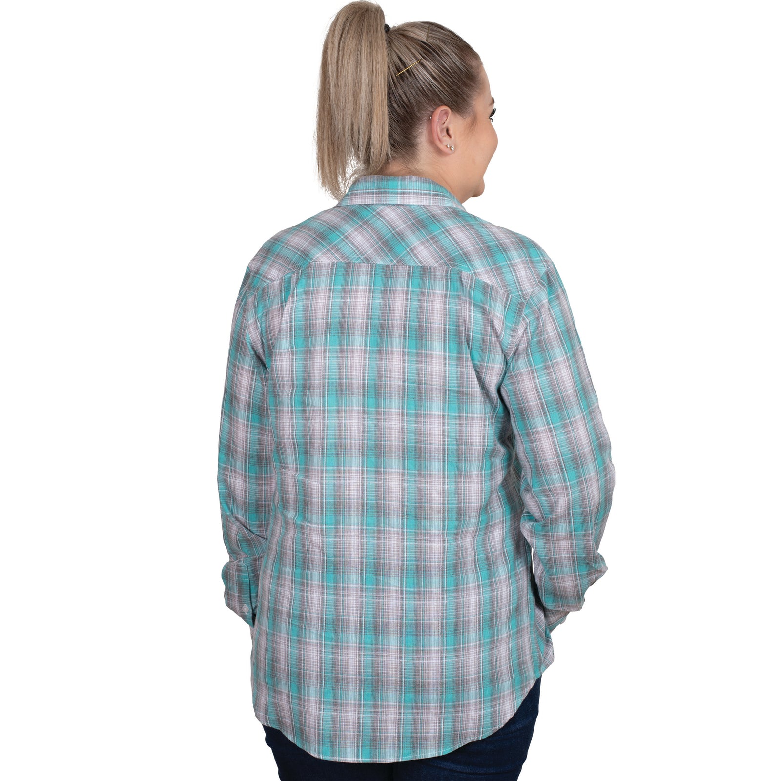 Just Country Women's Abbey Full Button Print Workshirt. A woman wearing a long-sleeved, full-button, plaid print workshirt in green and blue colors.