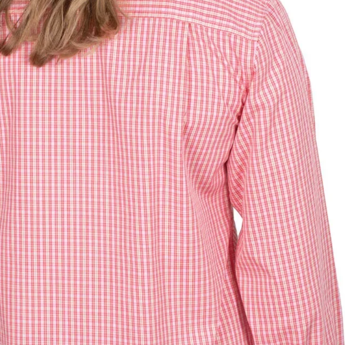 Close-up of a red and white checkered shirt on a person with a blurred background