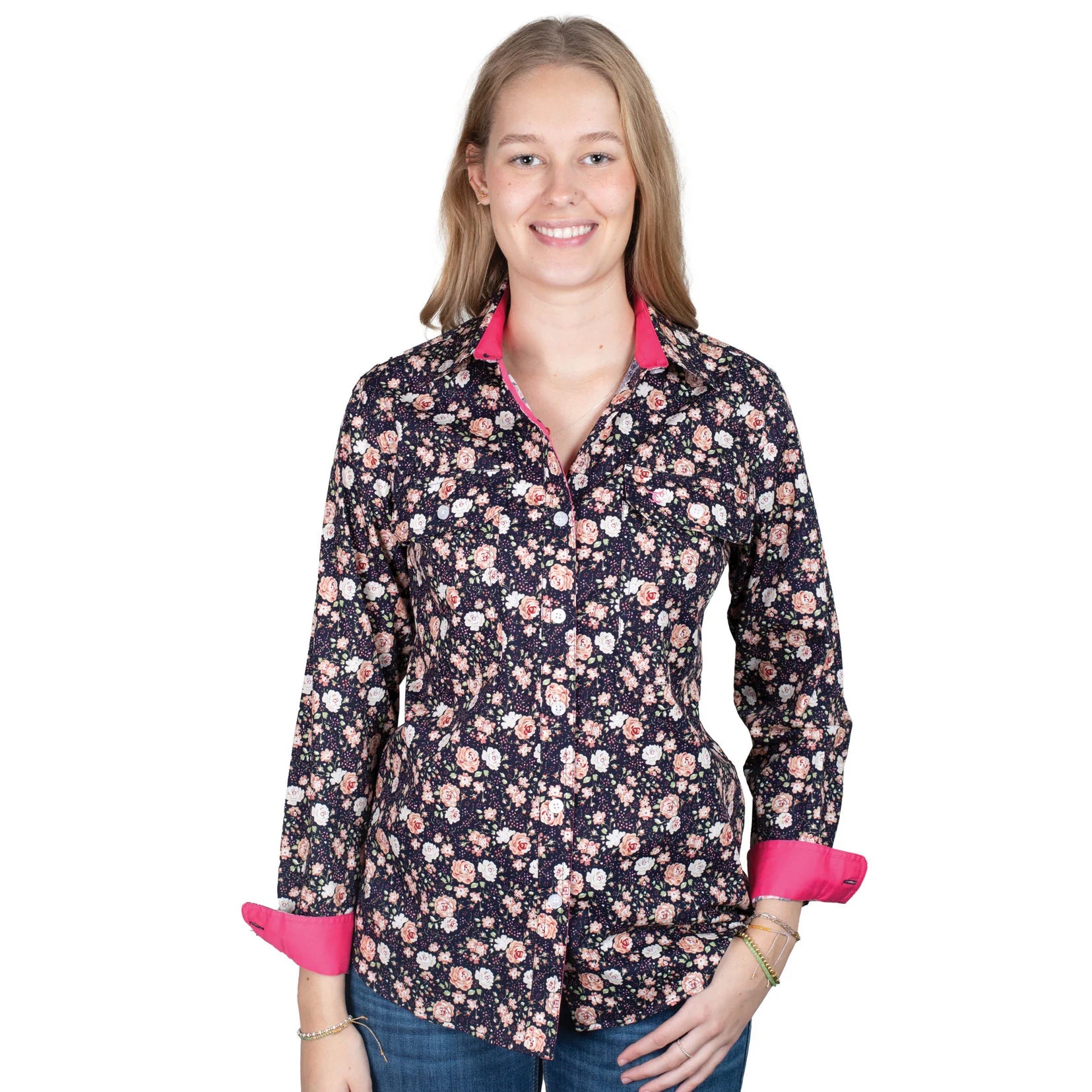 Just Country Women's Abbey Full Button Print Workshirt. Woman wearing a floral patterned shirt with pink accents on a white background