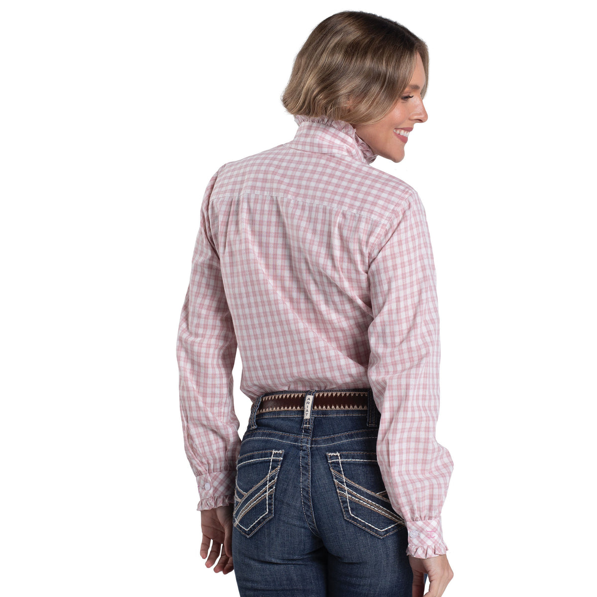 Woman wearing a pink and white checkered shirt and blue jeans on a white background