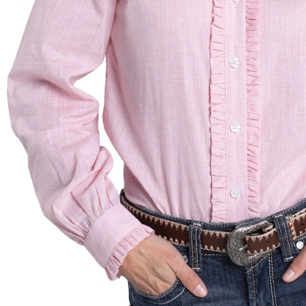 Close-up of a person wearing a pink shirt and jeans with a belt.