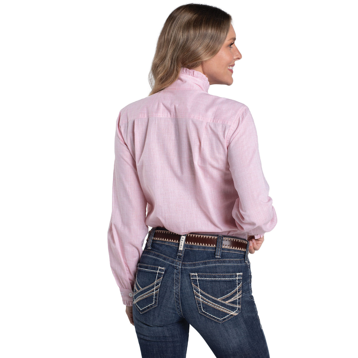 Woman wearing a pink long-sleeve shirt and blue jeans on a white background