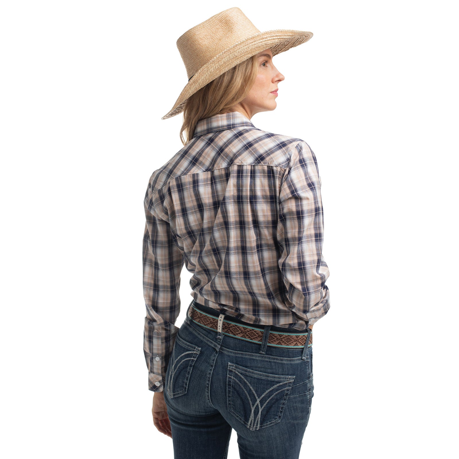 Woman wearing a plaid shirt, jeans, and a straw hat on a white background