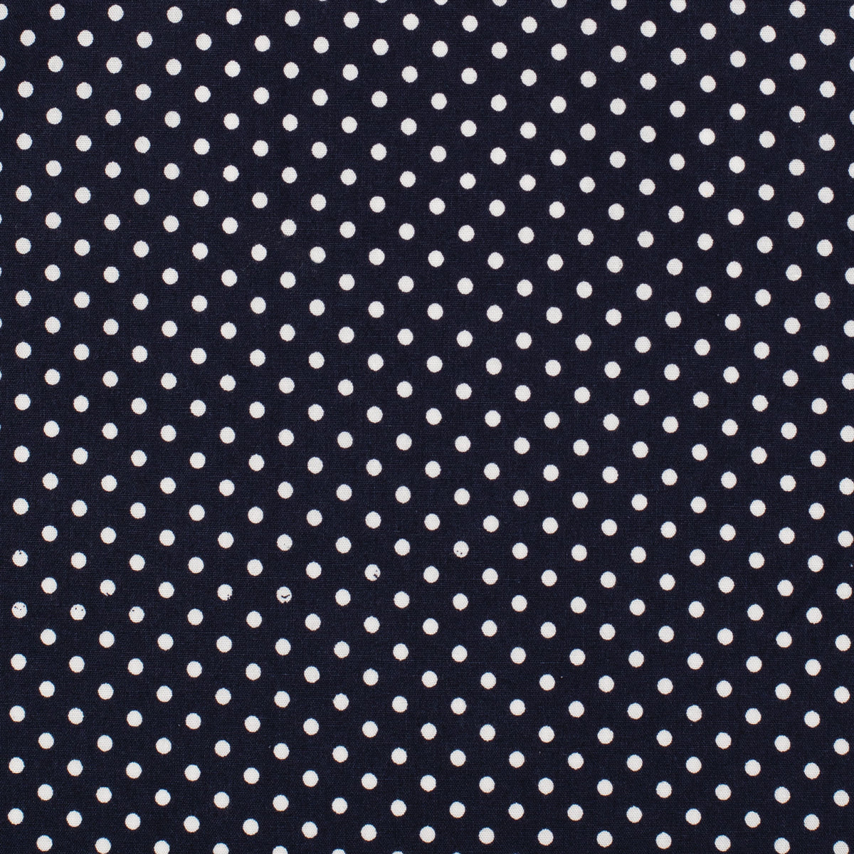 A close-up of a fabric pattern featuring small white polka dots on a dark navy blue background.