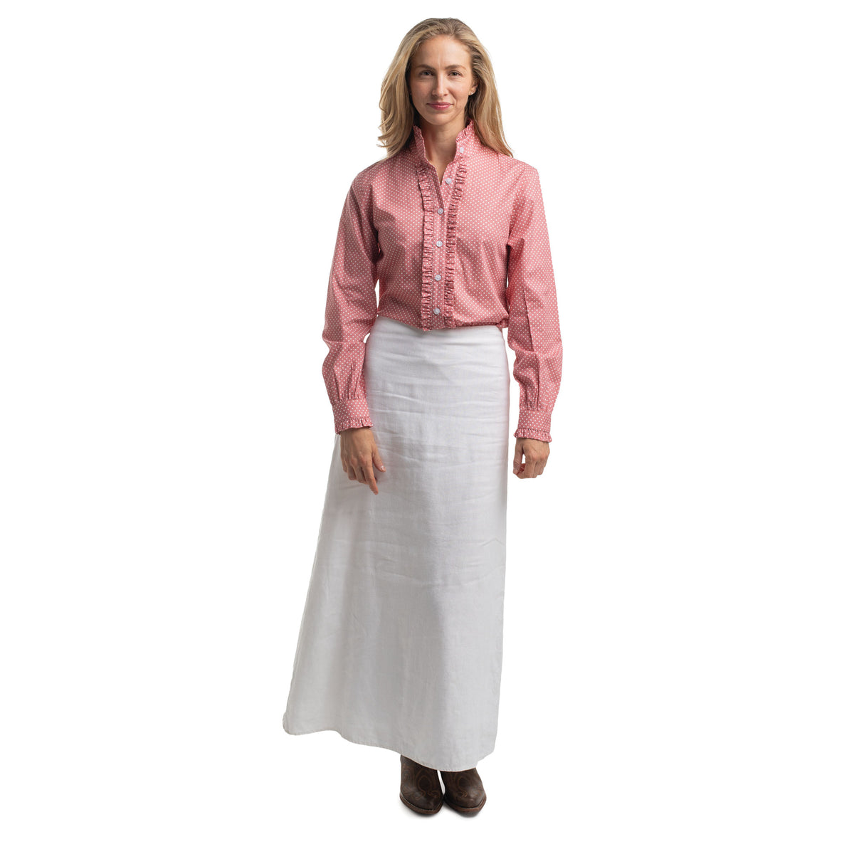 Woman wearing a pink shirt and white skirt on a white background