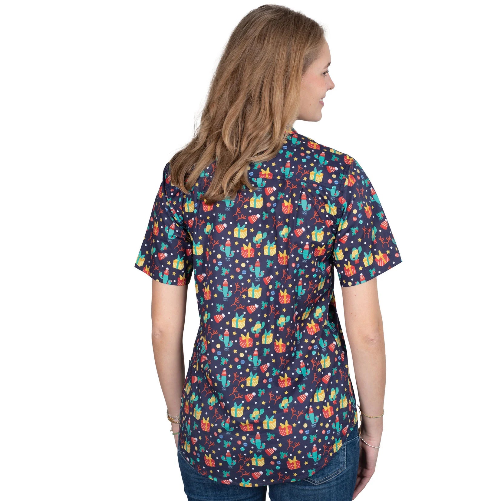 Just Country Women'sIzzy Full Button Print Short Sleeve Christmas Shirt. Woman wearing a colorful patterned shirt on a white background