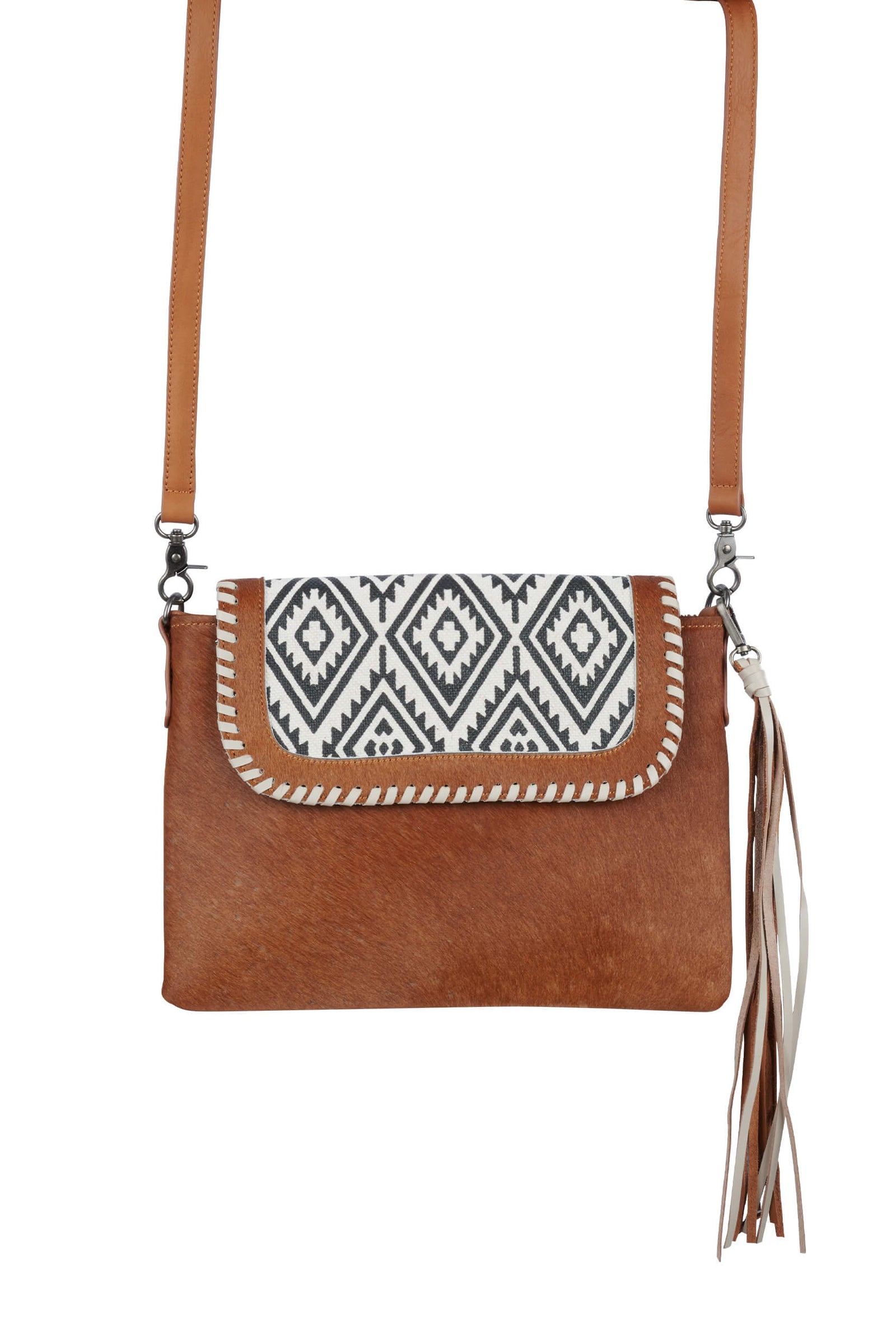 A brown Wrangler women's handbag with a geometric pattern on the foldover and a leather tassel, featuring a shoulder strap and metal badge.