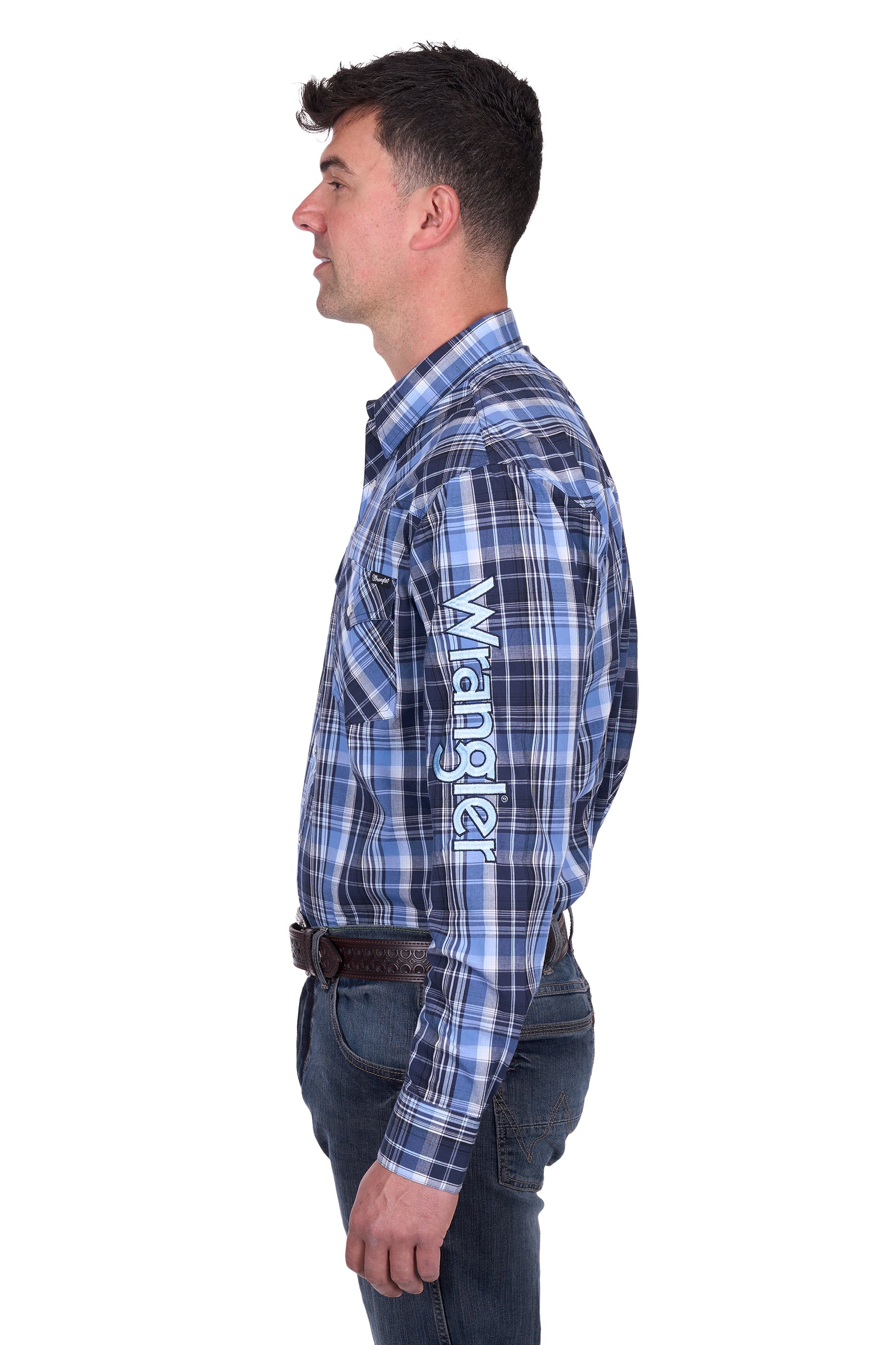 Wrangler Men's Billy Logo L/S Western Shirt. Man wearing a blue plaid shirt with 'Wrangler' branding on a white background