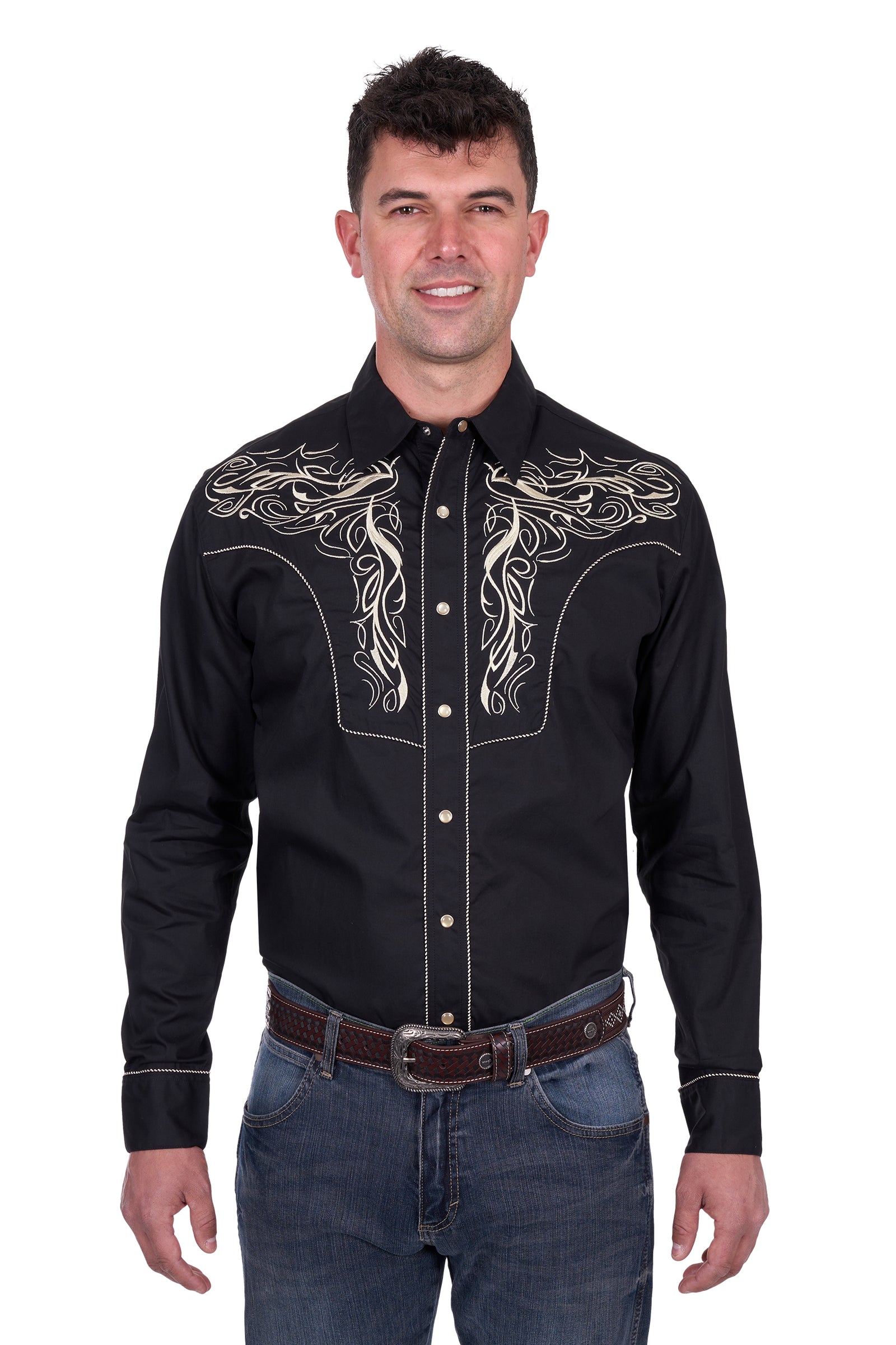 Wrangler Men's Carlos Embroidered L/S Western Shirt. Man wearing a black embroidered shirt with white designs on a white background