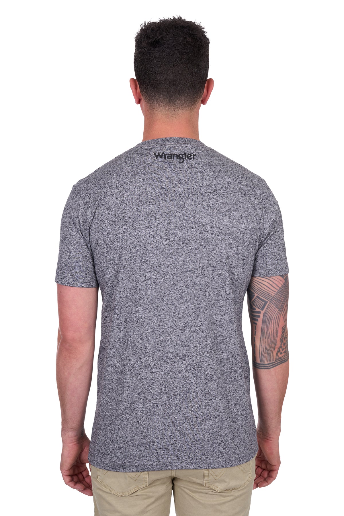 Wrangler Men's Darren S/S T-Shirt. Man wearing a gray t-shirt with Wrangler logo on the back, standing against a white background