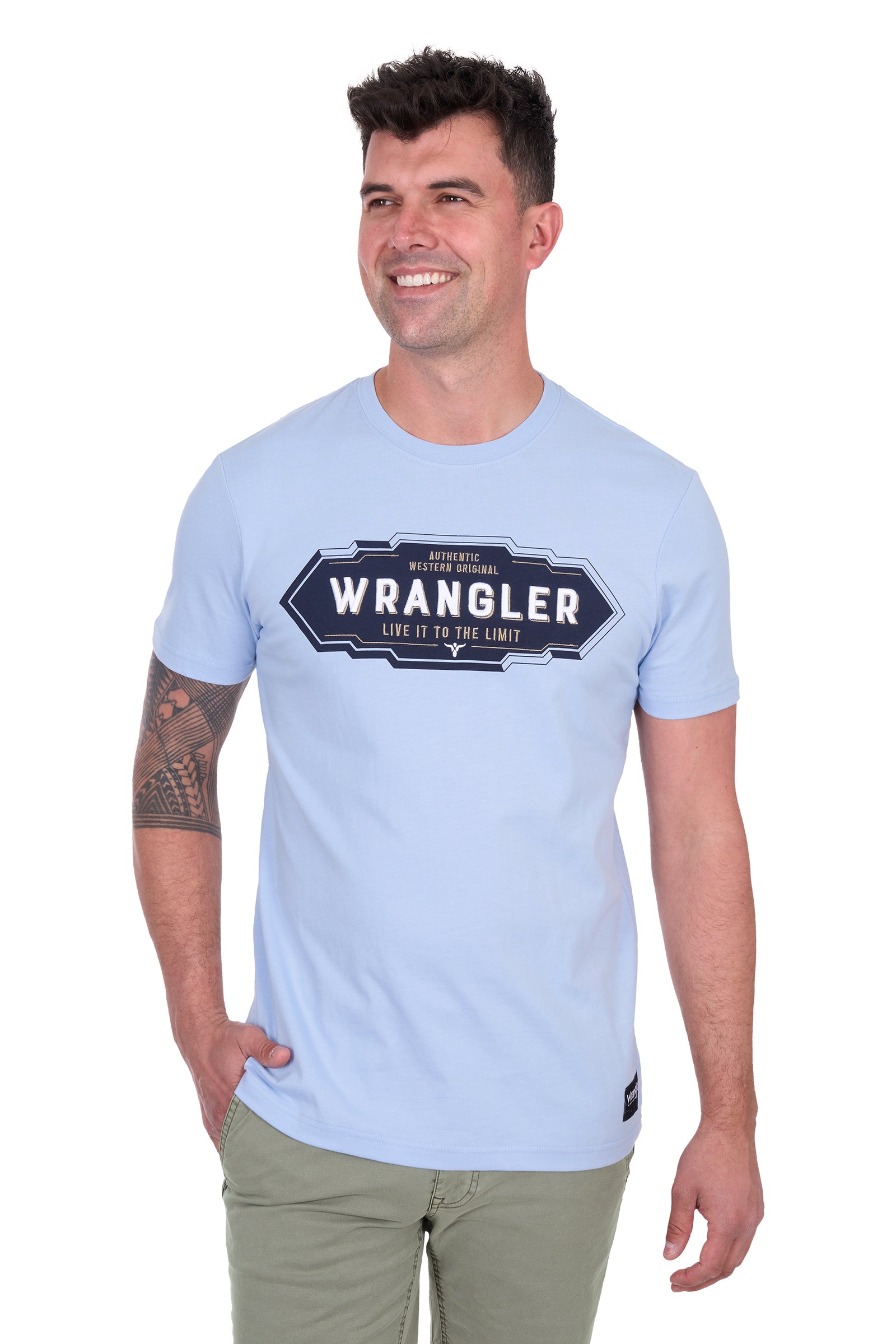 Wrangler Men's Roy S/S T-Shirt. Man wearing a light blue Wrangler t-shirt on a white background