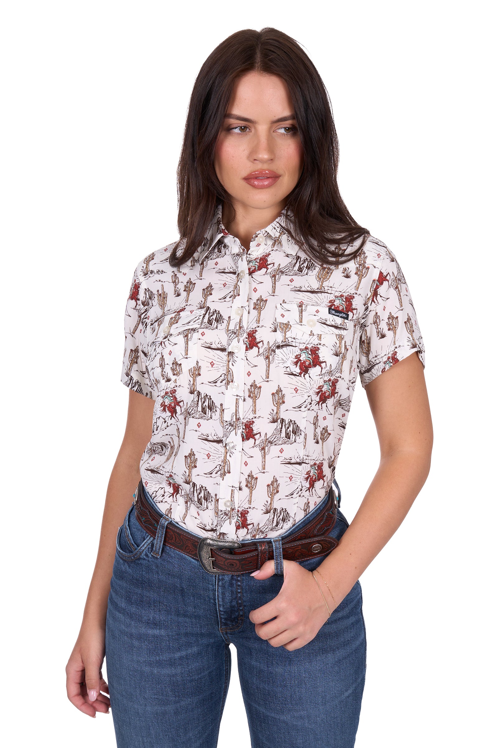Wrangler Women's Celeste S/S Western Shirt. Woman wearing a patterned shirt and jeans on a white background