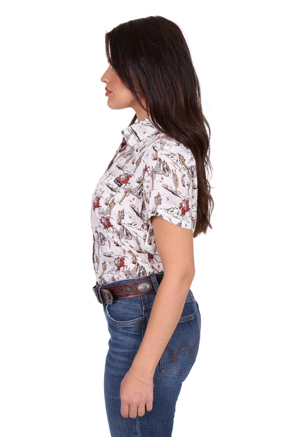 Wrangler Women's Celeste S/S Western Shirt. Woman wearing a patterned shirt and jeans on a white background