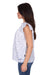 Wrangler Women's Harlow Sleeveless Blouse. Woman wearing a white lace top with blue jeans on a white background