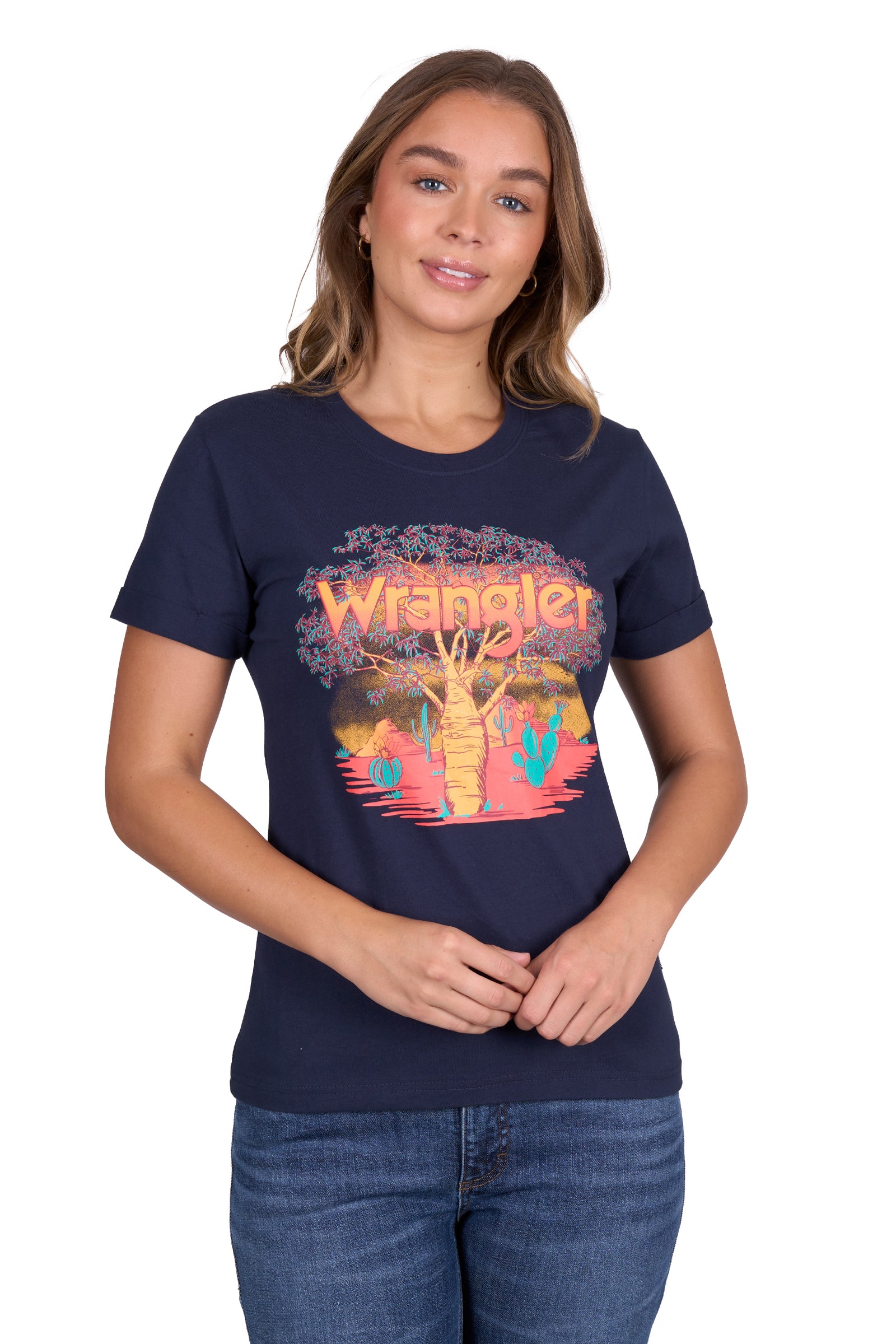 Wrangler Women's Lottie S/S T-Shirt. Person wearing a navy blue t-shirt with a colorful graphic design on a white background
