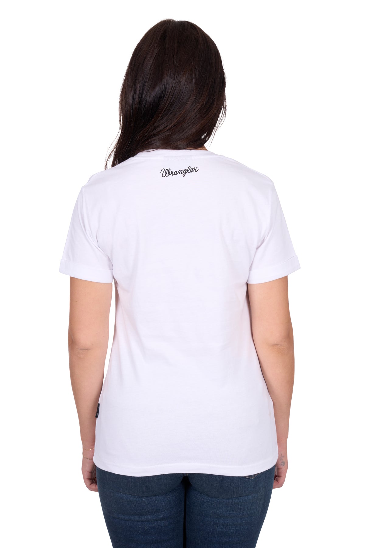 Wrangler Women's Julia S/S T-Shirt. Person wearing a white t-shirt with 'Wrangler' branding on the back, standing against a white background.
