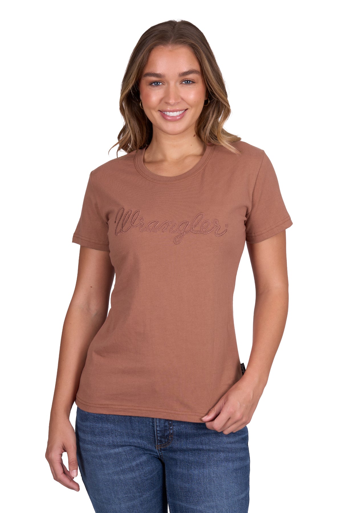 Wrangler Women&#39;s Texas S/S T-Shirt. Woman wearing a brown t-shirt with &#39;Wrangler&#39; logo on a white background