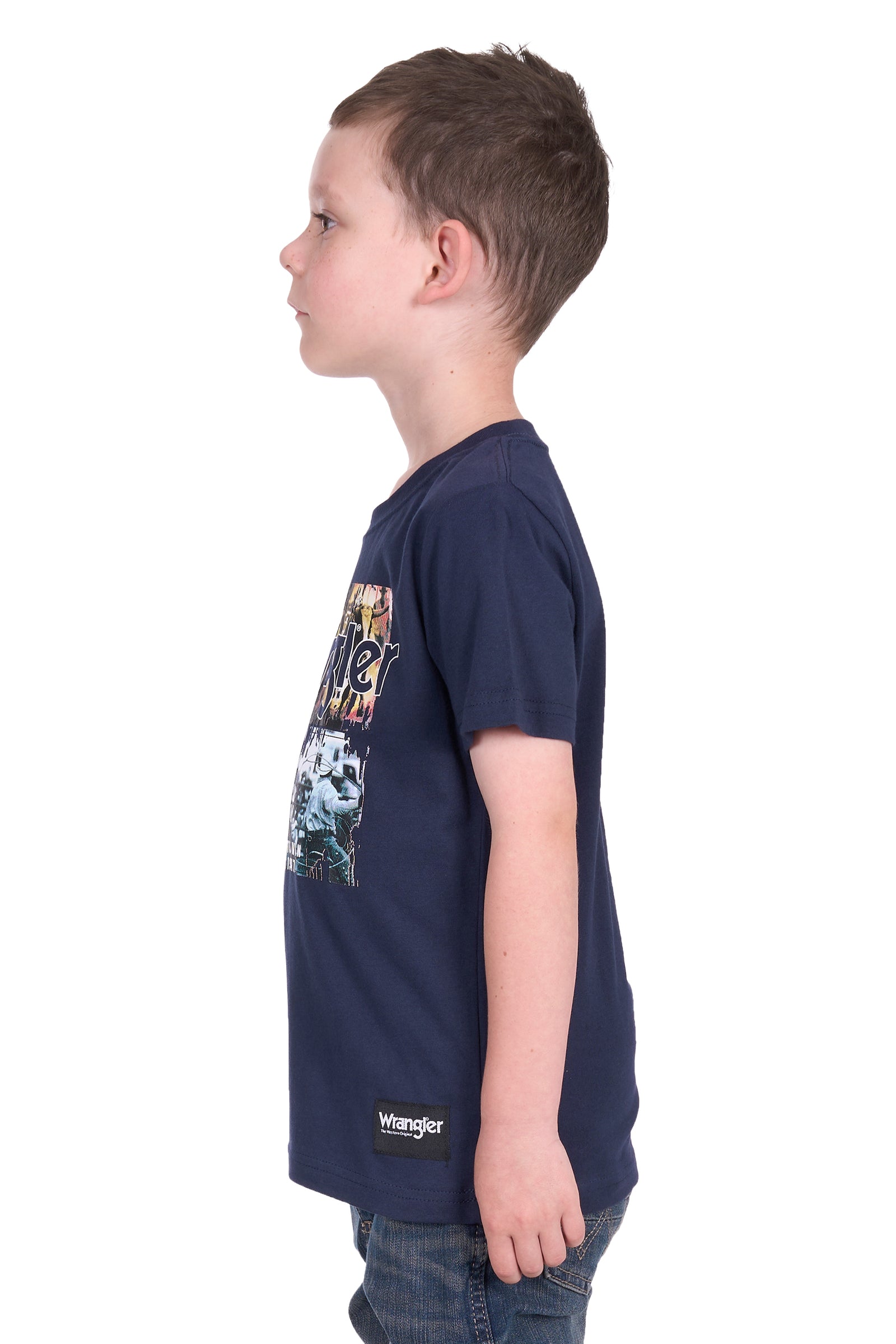 Wrangler Boy's Luis S/S T-Shirt. Child wearing a navy blue Wrangler t-shirt with a graphic design on a white background