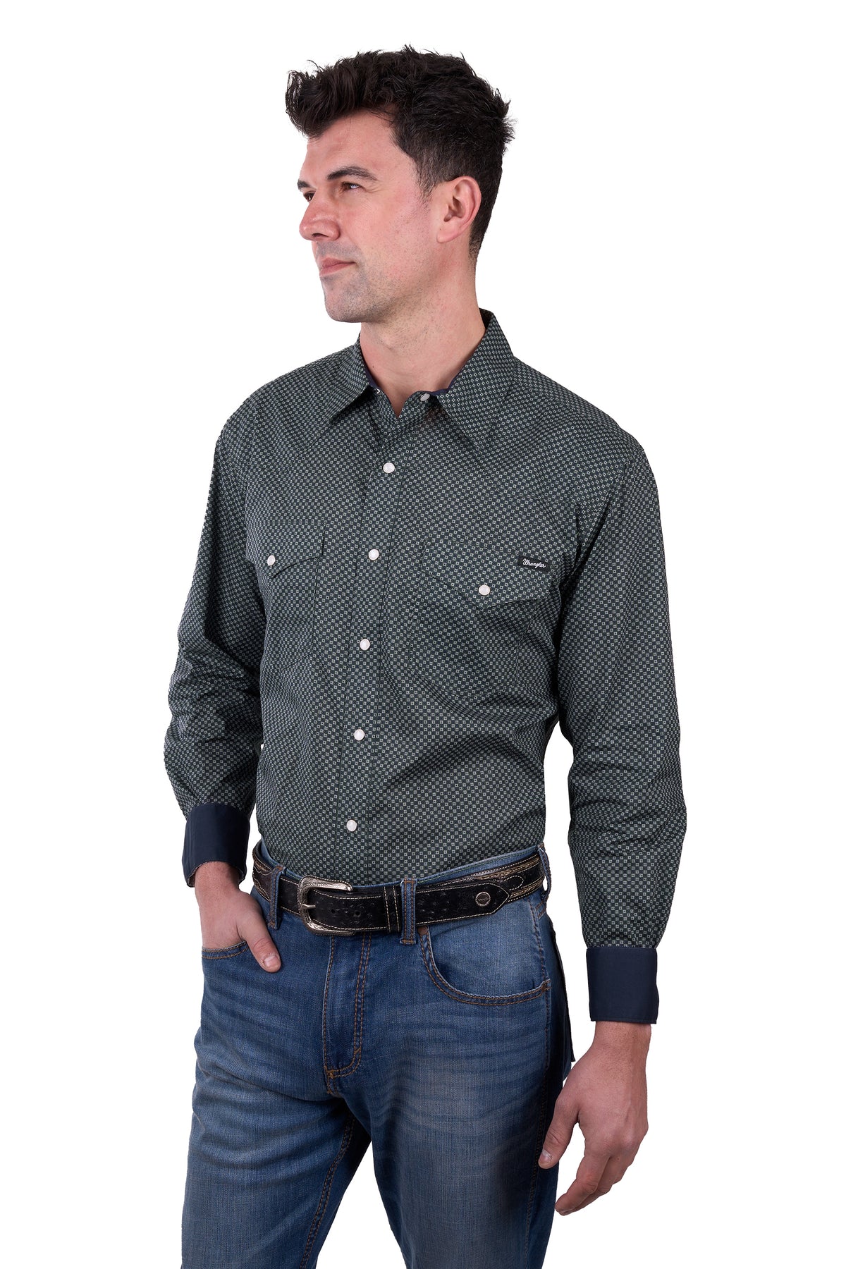 a man wearing a Wrangler Men's Steve L/S Western Shirt with denim jeans and a belt on a white background