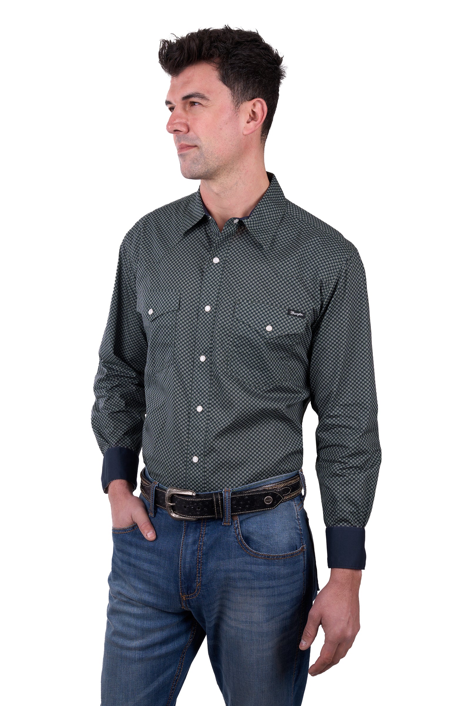 a man wearing a Wrangler Men's Steve L/S Western Shirt with denim jeans and a belt on a white background