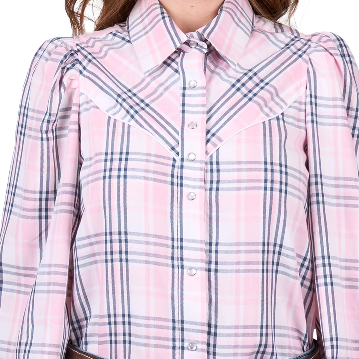 Close-up of a pink and blue plaid shirt with a collar.