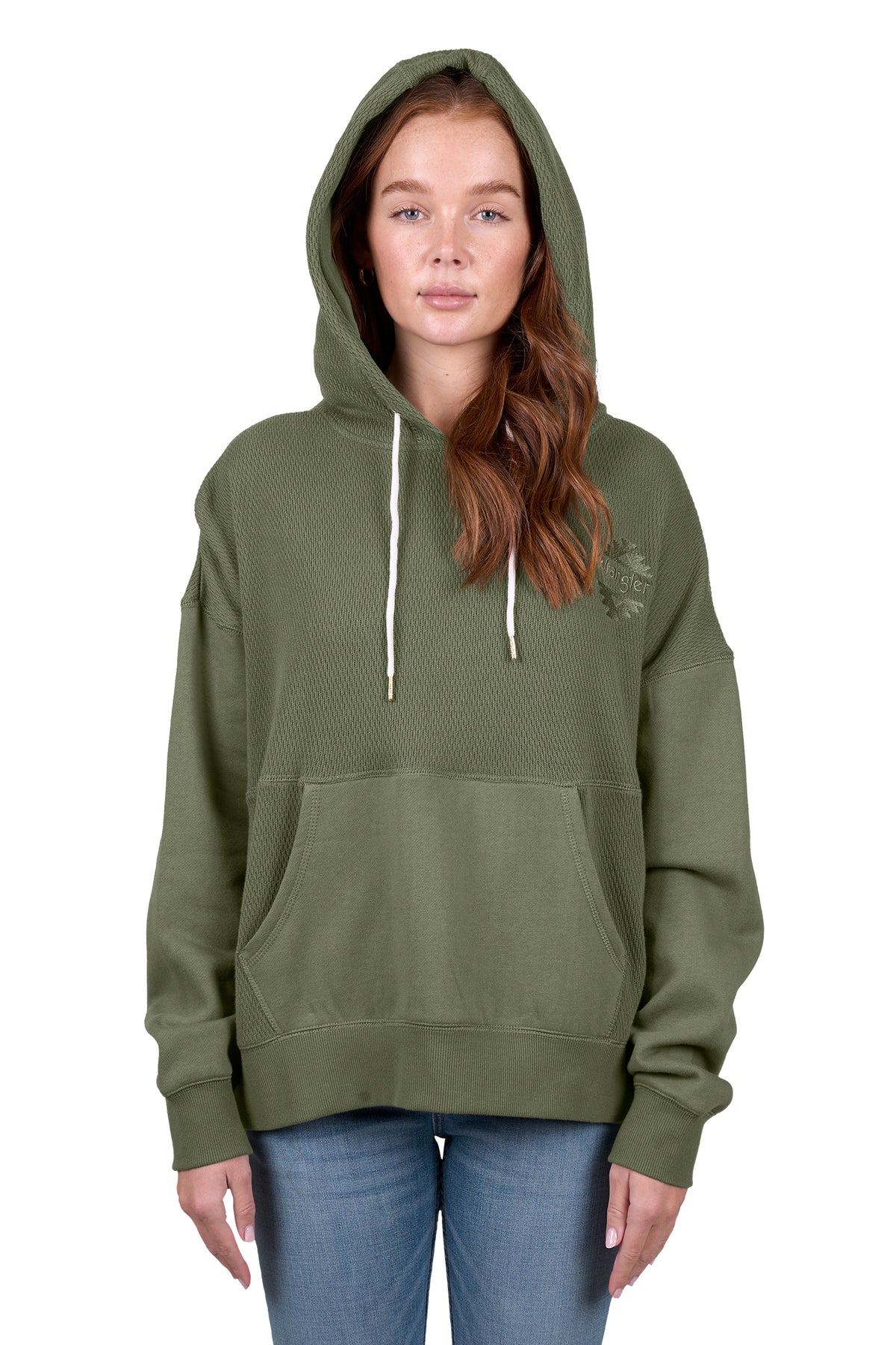 A woman wearing a green Wrangler Women's Lisa Hoodie with a front kangaroo pocket, hood with drawcord, and the Wrangler logo on the chest.