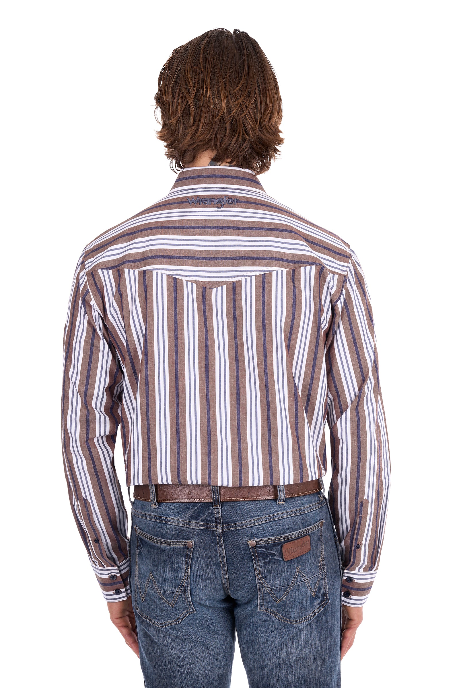 A man viewed from behind wearing a brown, white, and gray vertically striped long-sleeve button-down shirt with blue jeans and a brown belt, against a plain white background.