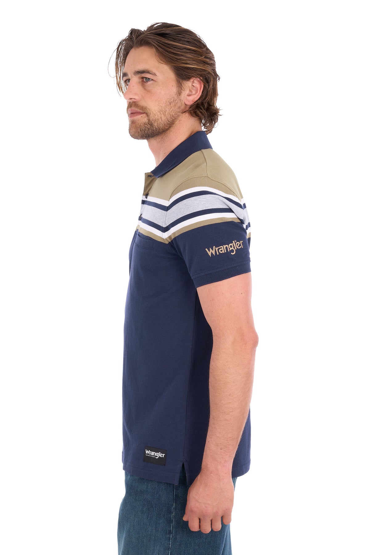 A man wearing a Wrangler short-sleeve polo shirt in navy blue with beige, white, and navy stripes across the shoulders and upper chest, shown in profile against a white background.