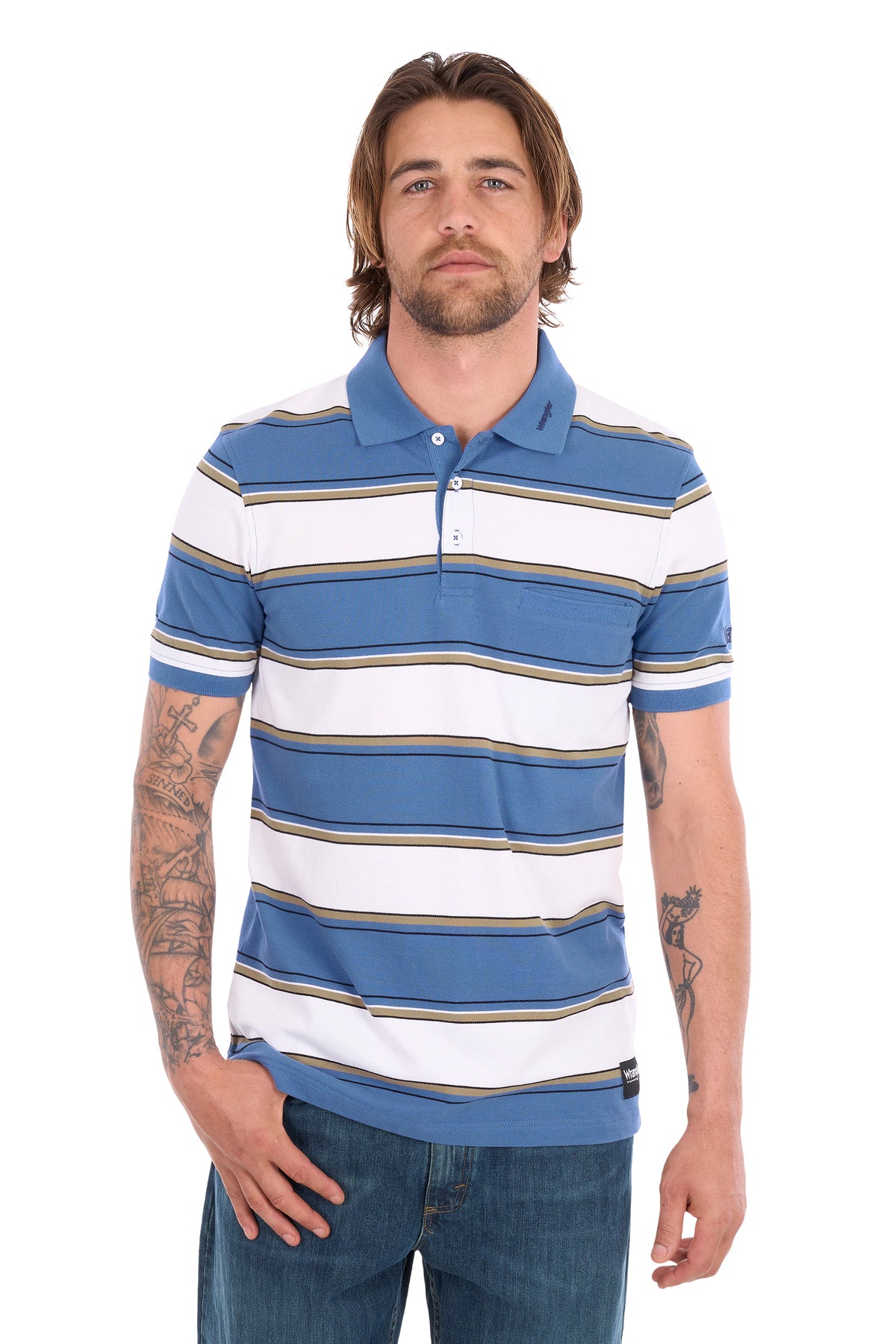 A man wearing a blue and white striped short-sleeve polo shirt with thin tan stripes, paired with blue jeans, against a plain white background.