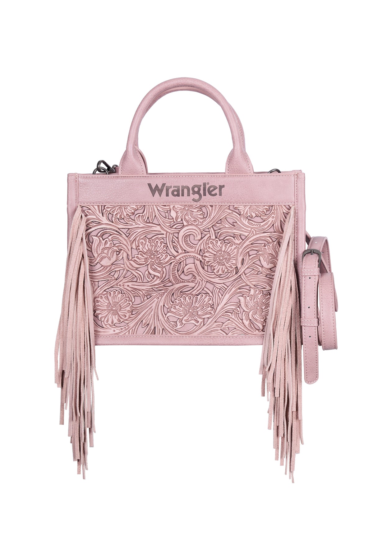 A light pink tooled leather handbag by Wrangler, featuring intricate floral tooling on the front, long fringe details on the sides, top handles, and a matching shoulder strap, shown against a plain white background.