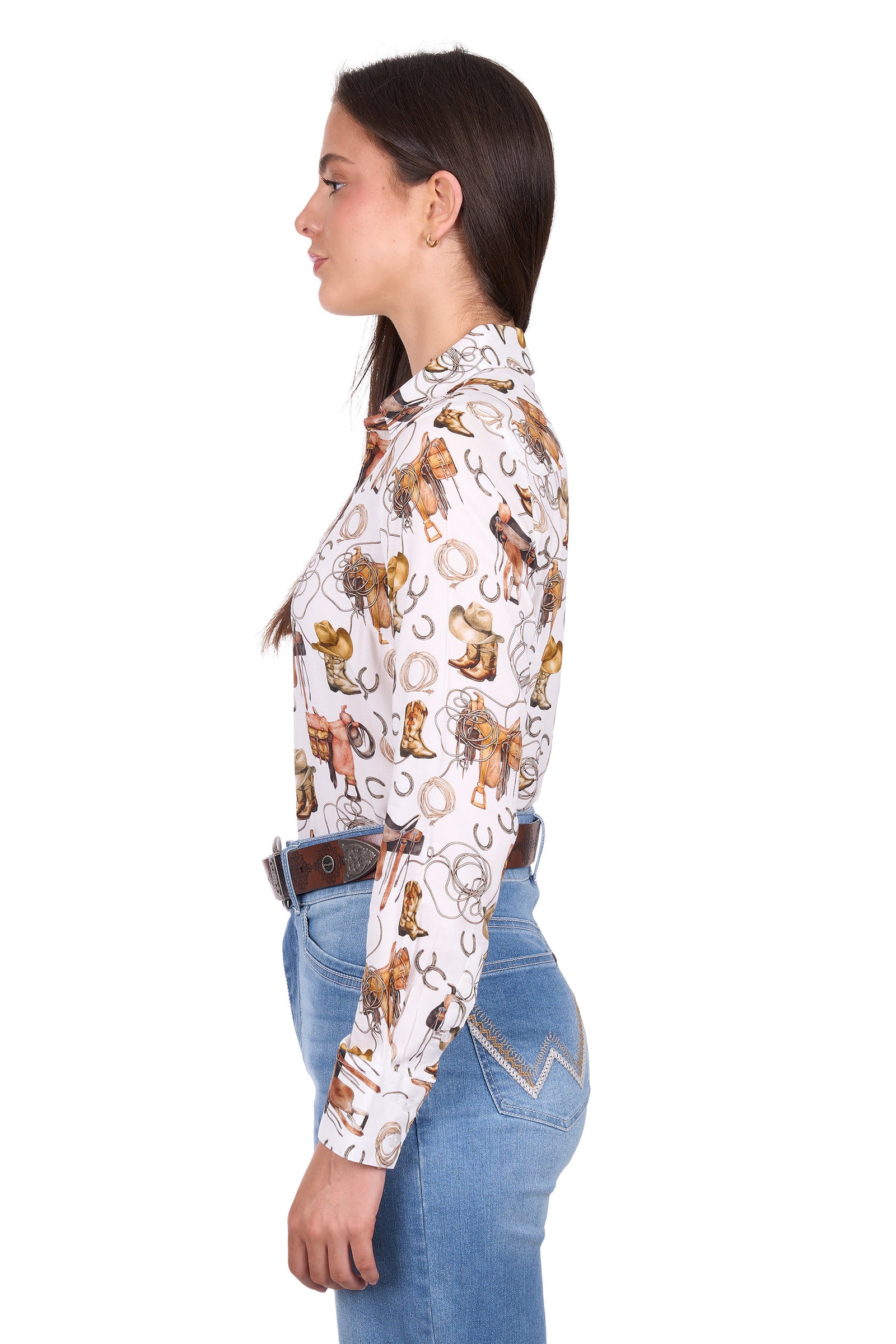 Woman wearing a patterned shirt with long sleeves and jeans on a white background