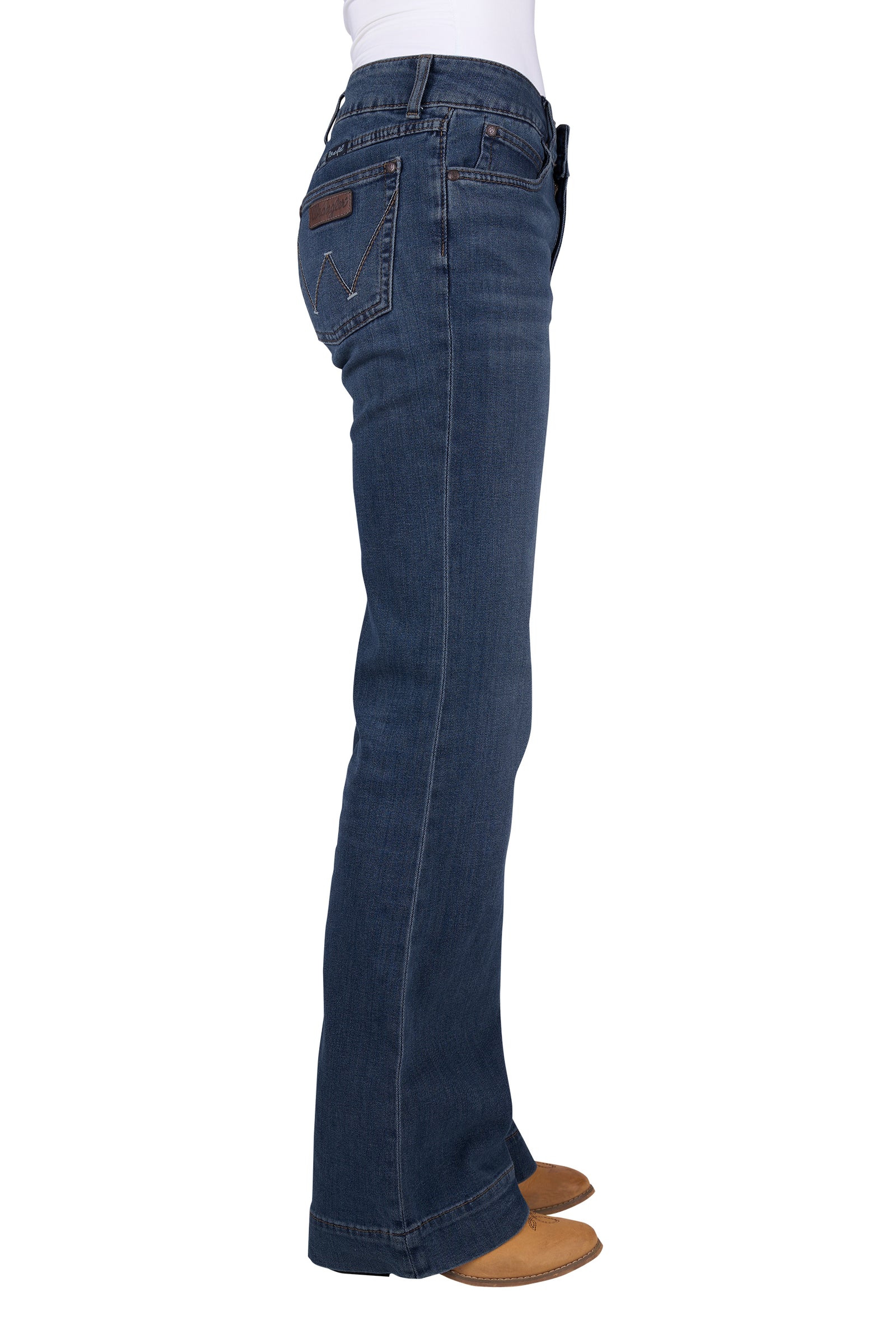 A pair of Wrangler Women's Mae Blair Trousers in a blue denim color, featuring a mid-rise waist, two front scoop pockets, and a gradual opening down the leg.