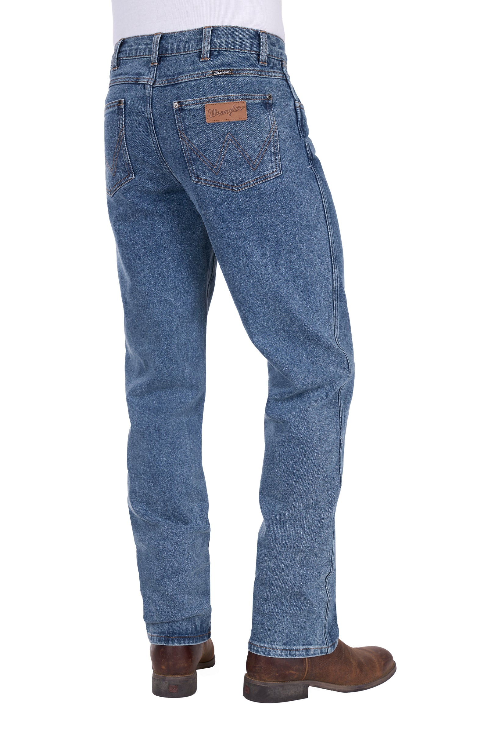 Blue jeans worn by a person on a white background