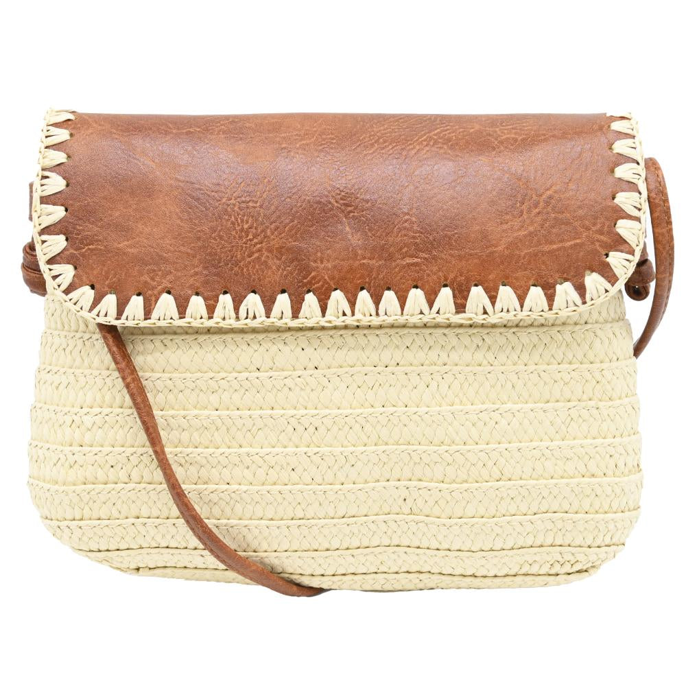 A woven straw shoulder bag with a brown faux-leather flap and a cream-colored zigzag stitched edge, featuring a brown shoulder strap against a white background.