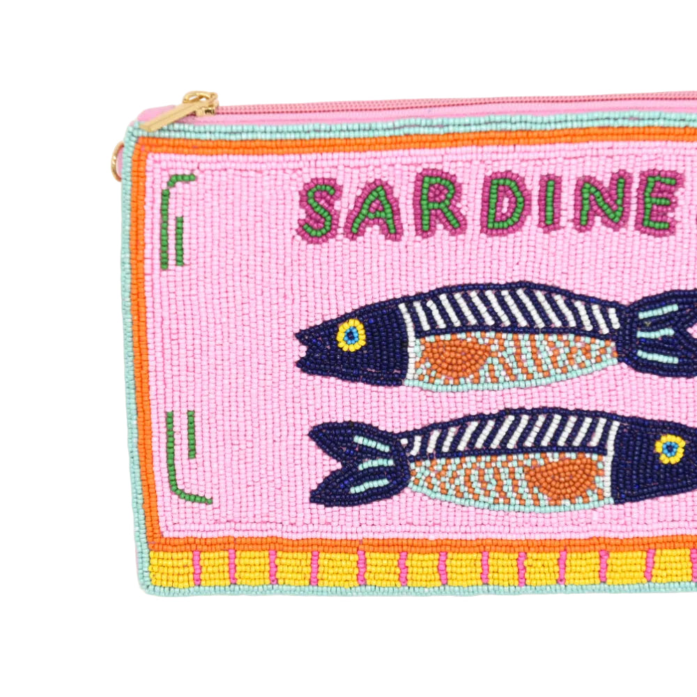A pink beaded zip pouch featuring embroidered sardines and the word 'SARDINE' in green beads, with a gold zipper pull, photographed on a white background.