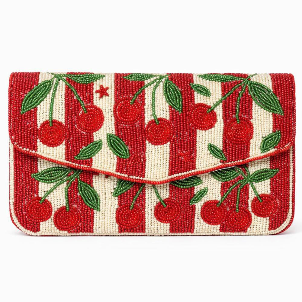 Handbag with cherry pattern on a white background
