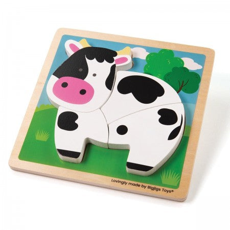 Bigjigs Toys Chunky Lift Out Puzzle - Cow. Wooden cow puzzle with colorful background on a white surface